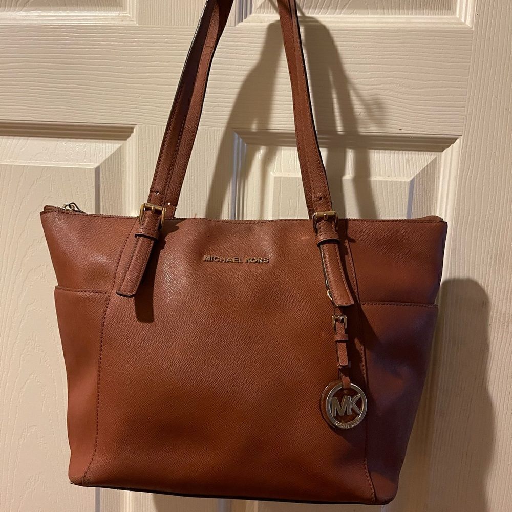 Michael Kors brown medium tote with gold tone hardwares and accents.